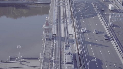 Electric Train Crossing Bridge over River Highway
