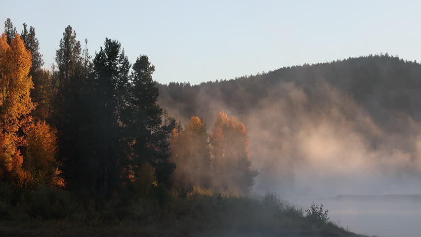 Fog Lifts on the Snake River at Dawn in Grand Teton National Park in Autumn
