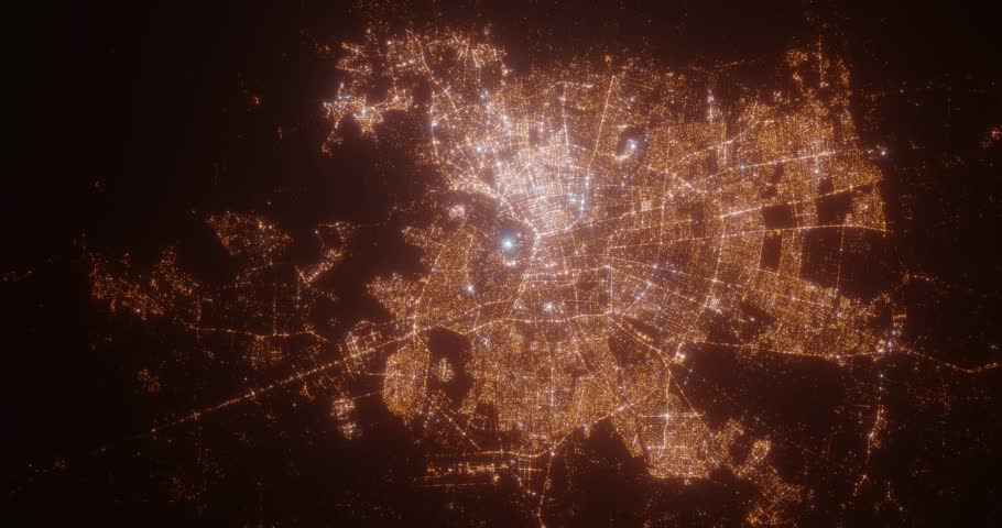 Santiago (Chile) top view at night. Aerial view on modern city with lights. Camera is flying above the city, moving backward. Vertical video. The north is on the left side