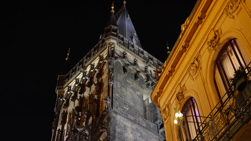 Powder Tower in Prague at night with illuminated Gothic details