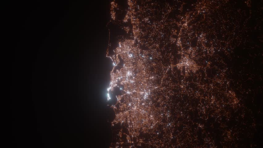 San Juan (Puerto Rico) top view at night. View on modern city from satellite. Camera is zooming in, rotating counterclockwise. Vertical video. The north is on the left side