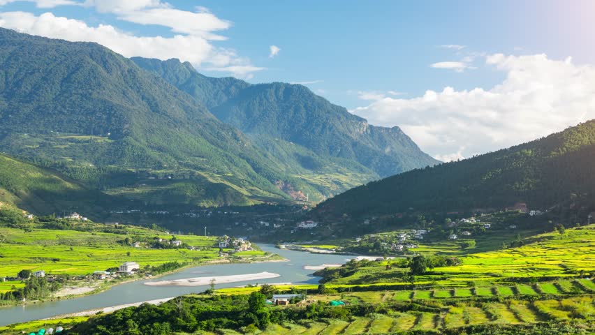 Time lapse of clouds moving over the rice paddies and the Punakha Valley in Bhutan.