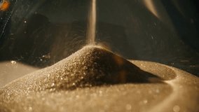 Macro close-up of an elegant hourglass with golden sand flowing slowly inside transparent glass, illuminated by warm evening light, symbolizing time and vintage elegance. - Powered by Shutterstock - Get 15% off with code: PIKWIZARD15