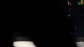 Close-up of dual laptop monitors displaying financial data charts, with an investor analyzing market graphs in a broker office. - Powered by Shutterstock - Get 15% off with code: PIKWIZARD15