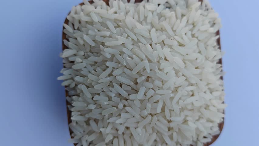 Close-up of rice in a wooden bowl