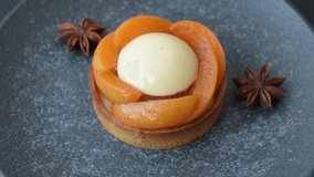 Pie, sweet round tart with apricot pieces, cream and nuts. Sweet tart with peach as a food background - Powered by Shutterstock - Get 15% off with code: PIKWIZARD15