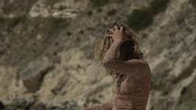 Stress Struggle Despair Young Woman Expresses Frustration on Coastal Rocks Vertical video. - Powered by Shutterstock - Get 15% off with code: PIKWIZARD15