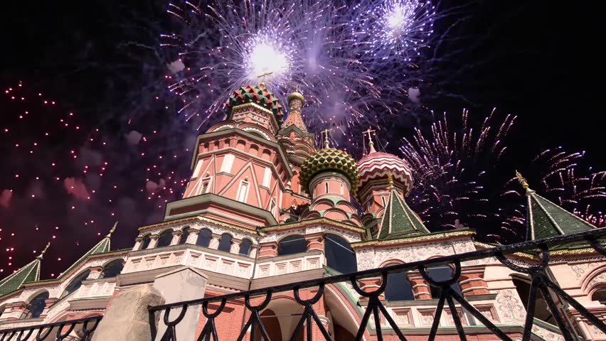 Temple of Basil the Blessed and fireworks in honor of Victory Day celebration (WWII), Red Square, Moscow, Russia. Time lapse 