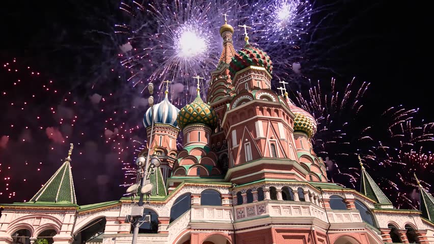 Temple of Basil the Blessed and fireworks in honor of Victory Day celebration (WWII), Red Square, Moscow, Russia. Time lapse 