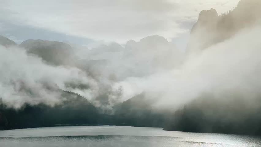 Discovering the serene beauty of Gosau Lake in Austria shrouded in morning mist