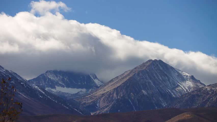time-lapse of turbulent winter storm clouds over the Sierra Nevada mountains and Mount Sill near Big Pine, California.