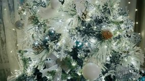 decorative holiday tree adorned with shimmering ornaments and cozy lighting, indoor festive arrangement showcasing frosted pine tree with sparkling embellishments - Powered by Shutterstock - Get 15% off with code: PIKWIZARD15