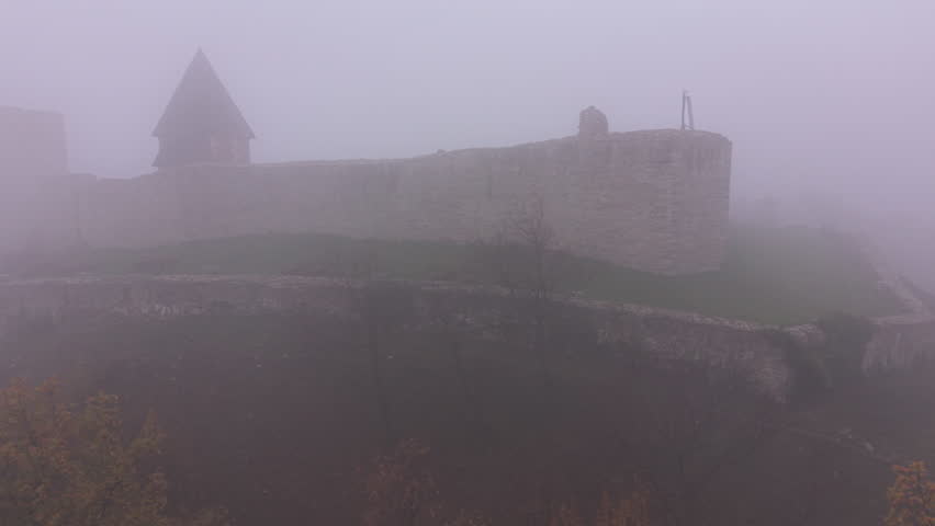 4K drone pan of Medvedgrad Fortress in fog with autumn trees, Zagreb, Croatia. D-LOG M, DJI Mini 5 Pro. Cinematic aerial for travel and documentary.