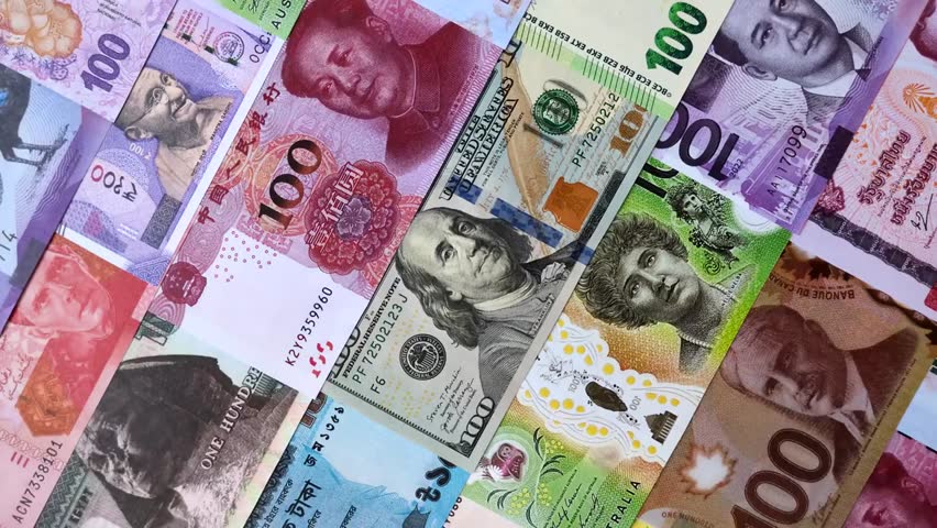 Various international paper banknotes spread out as a colorful business background symbolizing global finance, currency exchange, trade, and cash wealth. - Powered by Shutterstock - Get 15% off with code: PIKWIZARD15