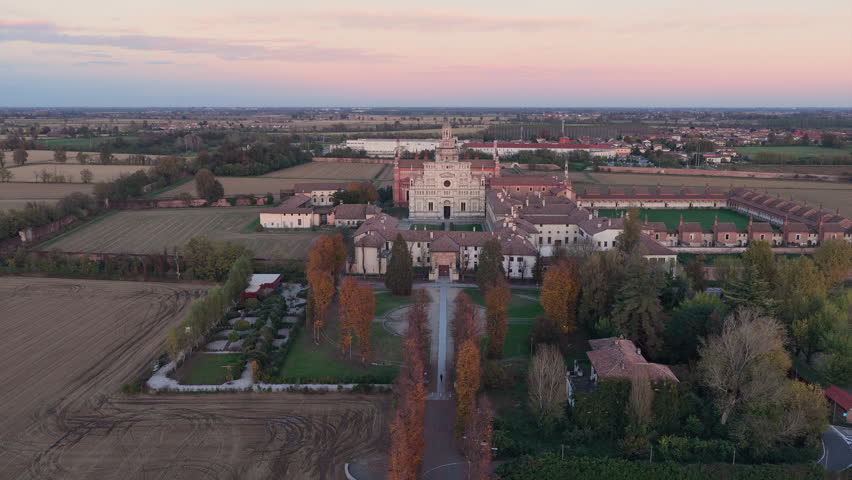 Certosa di Pavia aerial view at sunset Gra-Car (Gratiarum Carthusia, Monastery of Santa Maria delle Grazie - Sec. XIV),Pavia, Italy.