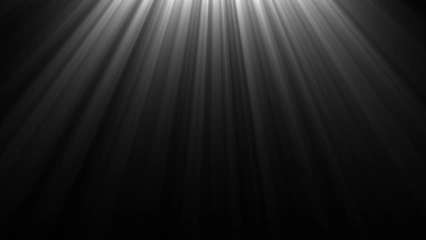 Soft, diffused light rays descend from the top of a dark frame, creating a dramatic and atmospheric effect. Clear details and vibrant colors enhance visual appeal.