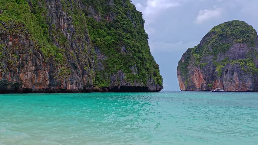 Maya Bay is a famous bay on the island of Koh Phi Phi Leh, Thailand. Cristal Clear Blue and turquoise water in lagoon