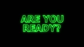 A vibrant green neon sign with the words "ARE YOU READY?" in capital letters is displayed against a black background. The neon tubing emits a bright, consistent glow. Clear details and vibrant col... - Powered by Shutterstock - Get 15% off with code: PIKWIZARD15