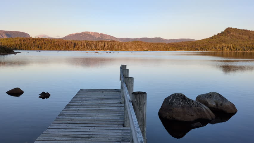 Sunset on the Gull pond with the mountains of the Gros Morne National Park in background (Rocky Harbour, Newfoundland, Canada)