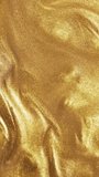Liquid gold motion organic background. Shine glitter fluid metallic yellow color paint. Texture abstract acrylic cloud swirling underwater. - Powered by Shutterstock - Get 15% off with code: PIKWIZARD15