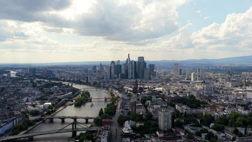 Dramatic aerial view flying towards modern skyscrapers of Frankfurt