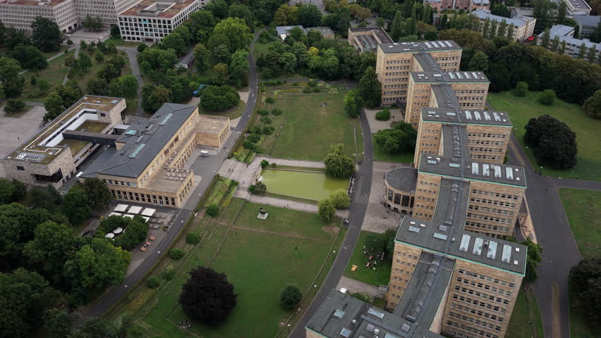 Aerial footage orbiting iconic IG Farben building, now part of Goethe University Westend Campus in Frankfurt am Main, Germany