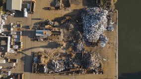 Aerial view of industrial scrapyard with excavators sorting metal debris - Powered by Shutterstock - Get 15% off with code: PIKWIZARD15