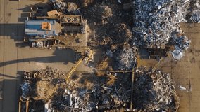 Aerial view of industrial scrapyard with excavators sorting metal debris - Powered by Shutterstock - Get 15% off with code: PIKWIZARD15