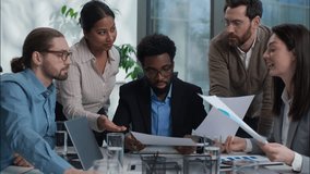 Multiethnic diversity business team Indian businesswomen Caucasian African businessmen men women coworkers office workers discuss strategy plan paperwork document briefing analysis colleagues talking - Powered by Shutterstock - Get 15% off with code: PIKWIZARD15