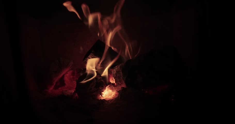 Fireplace, logs on fire calm warm cozy atmosphere by the flames