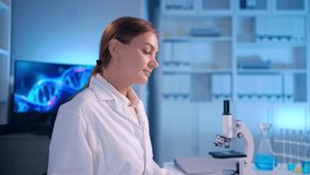 Portrait of Caucasian female scientist in white lab coat in laboratory. Attractive woman technician researcher sit at desk, working to analyze and conduct test for medical development in science lab. - Powered by Shutterstock - Get 15% off with code: PIKWIZARD15