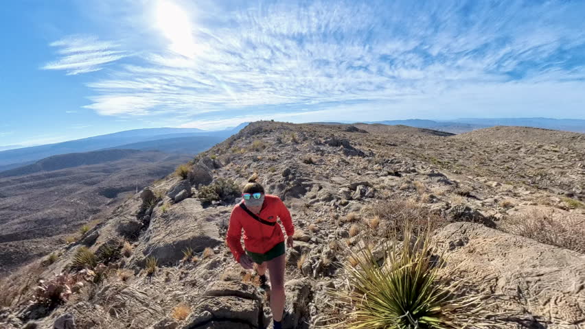 Woman Hikes Across Rugged Desert Terrain in Big Bend