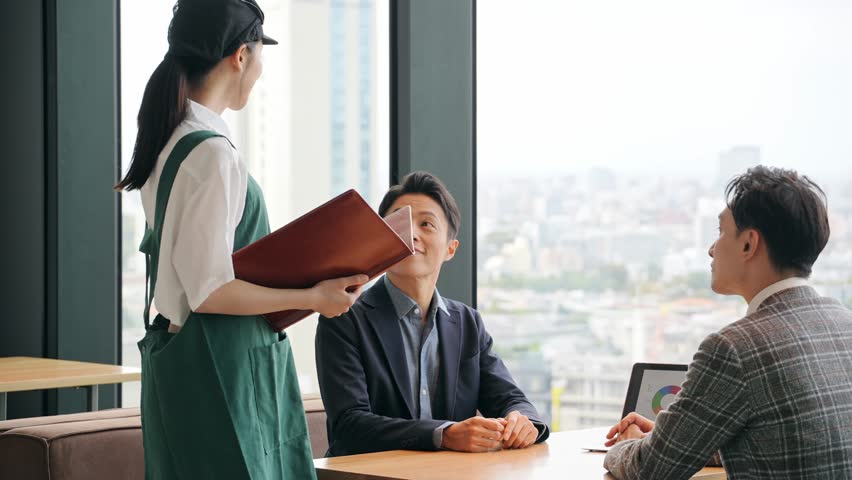 Restaurant staff serving customers in the store