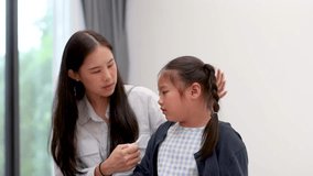 Mother Comforts Daughter and Helps Adjust Face Mask - Powered by Shutterstock - Get 15% off with code: PIKWIZARD15