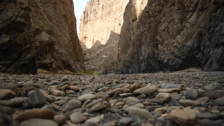 Woman Hikes Over Rocks into Mariscal Canyon in Big Bend National Park