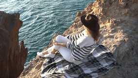 Relaxing Cliff Ocean View Young Woman Enjoys Solitude at Sunset Vertical video. - Powered by Shutterstock - Get 15% off with code: PIKWIZARD15