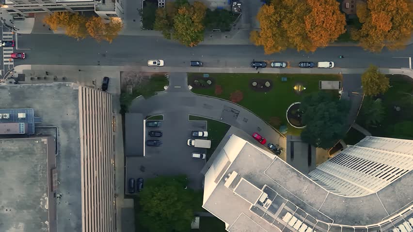 Stunning top drone view of building rooftops, modern downtown skyscrapers, busy traffic, crossroads in evening Toronto, Ontario, Canada.