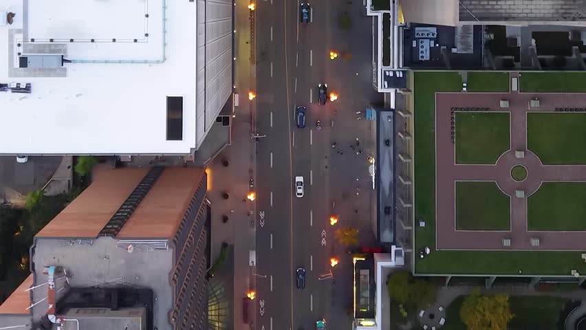 Stunning top drone view of building rooftops, modern downtown skyscrapers, busy traffic, crossroads in evening Toronto, Ontario, Canada.