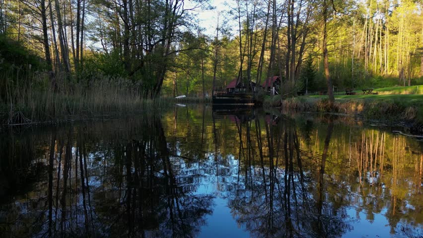 Drone Flying Over Old Wooden Pier on Calm Water