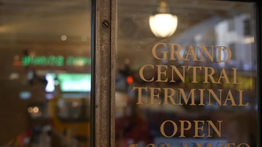 Grand Central Terminal on 42 street, New York City Manhattan Midtown. Details of railway building entrance in United States. American public railroad transport. Retro vintage station exterior. Doors.