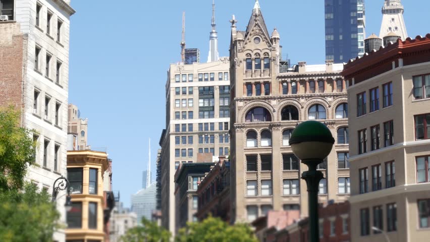New York City Manhattan Midtown Union square on Broadway street, United States of America. Old historic building urban architecture. Subway metro entrance green orb globe on Ladies mile. USA cityscape