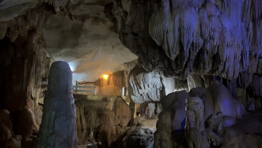 Wang Vieng, Laos.Tham Jang Cave-stalactites and stalagmites in a karst mountain with a Buddha temple inside. There is a spring inside the cave. The cave is equipped with comfortable paths and lanterns