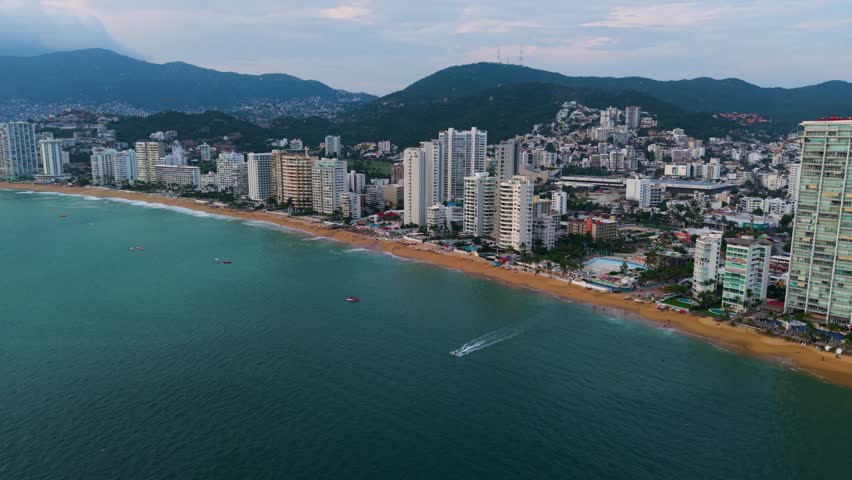 Aerial view of Acapulco Bay at dusk, captured along Guerrero