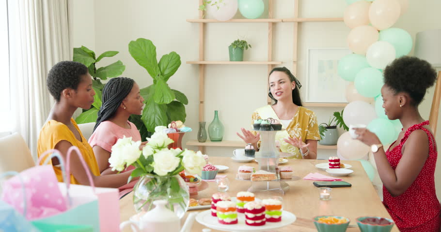 With sash arriving pregnant woman in yellow dress delivering thanks to friends sampling desserts. Celebration, friendship, pastel, femininity, joy, elegance, social gathering