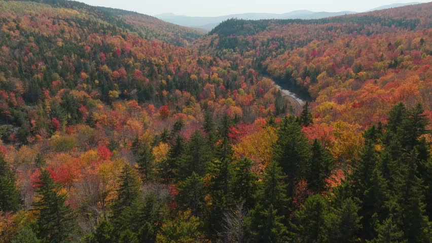 Aerial Drone View of Route 4 in Western Maine - Scenic Highway Through Vibrant Fall Foliage