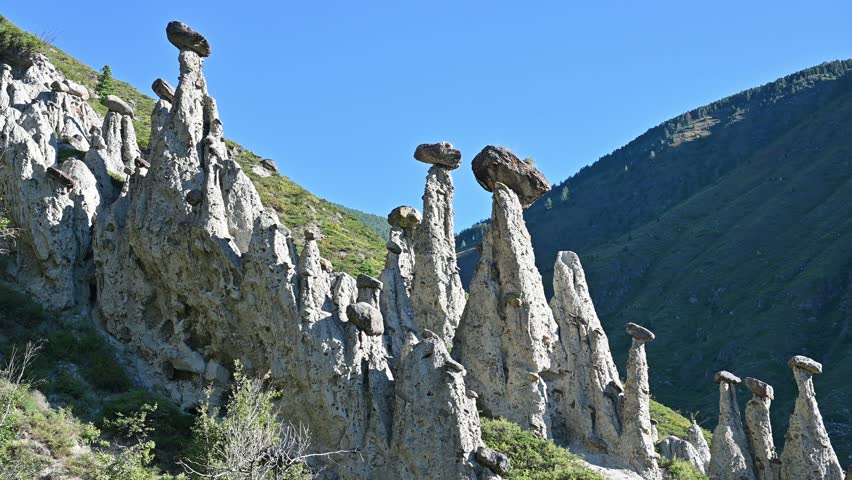 Famous stone mushrooms rock formations in Altai, Russia. Geological landmark and popular tourist attraction
