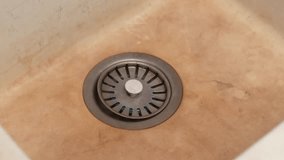 Dirty sink with visible mineral stains and corroded metal drain highlights hard water effects and lack of regular maintenance - Powered by Shutterstock - Get 15% off with code: PIKWIZARD15