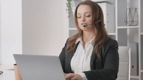 A professional woman leads a virtual meeting from her home office, wearing a stylish headset and engaging with her laptop, representing modern remote work practices prevalent today - Powered by Shutterstock - Get 15% off with code: PIKWIZARD15