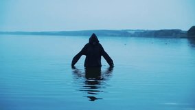 Dark cinematic scene of a mysterious witch or dark wizard spinning in an autumn field, evoking eerie supernatural energy and gothic fantasy with horror and mystical atmosphere. - Powered by Shutterstock - Get 15% off with code: PIKWIZARD15