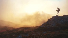 Adventurous hiker exploring foggy mountains while searching for the right path, symbolizing courage, exploration, determination, and the beauty of nature’s mysterious landscapes. - Powered by Shutterstock - Get 15% off with code: PIKWIZARD15